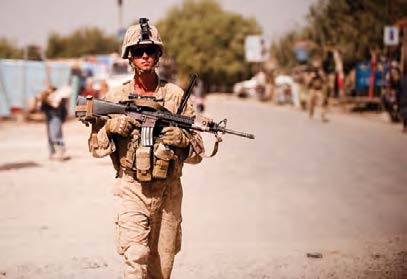 Andrew Englund in military fatigues on a beach