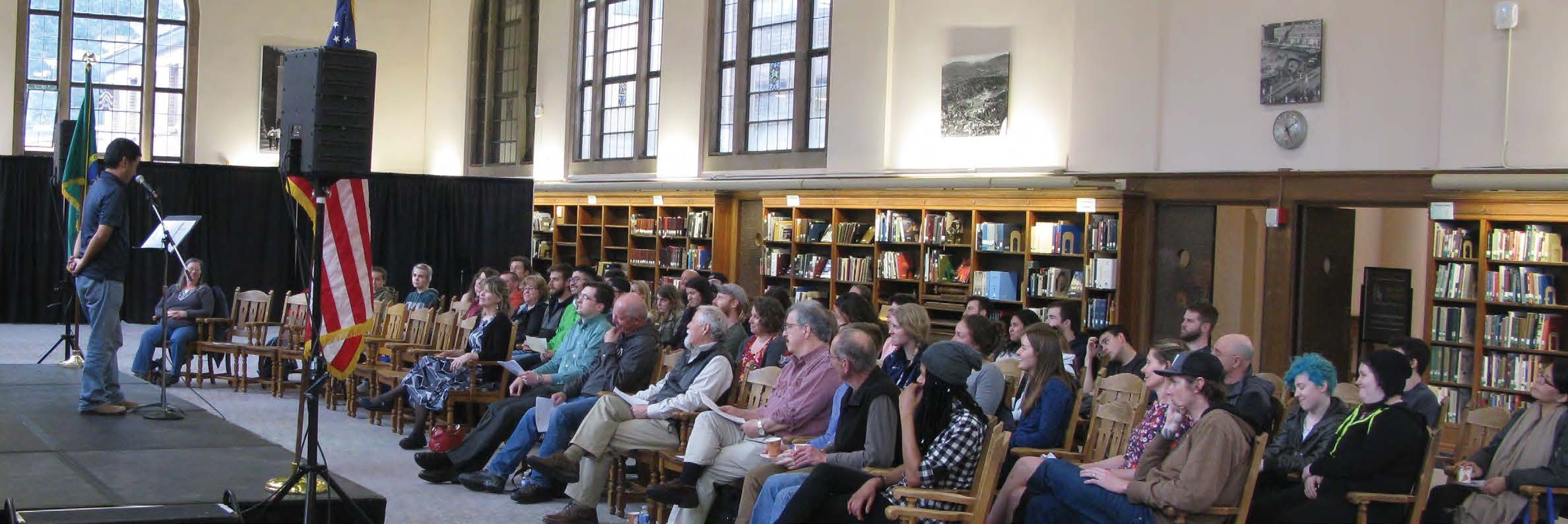 Audience in a library watching a presenter